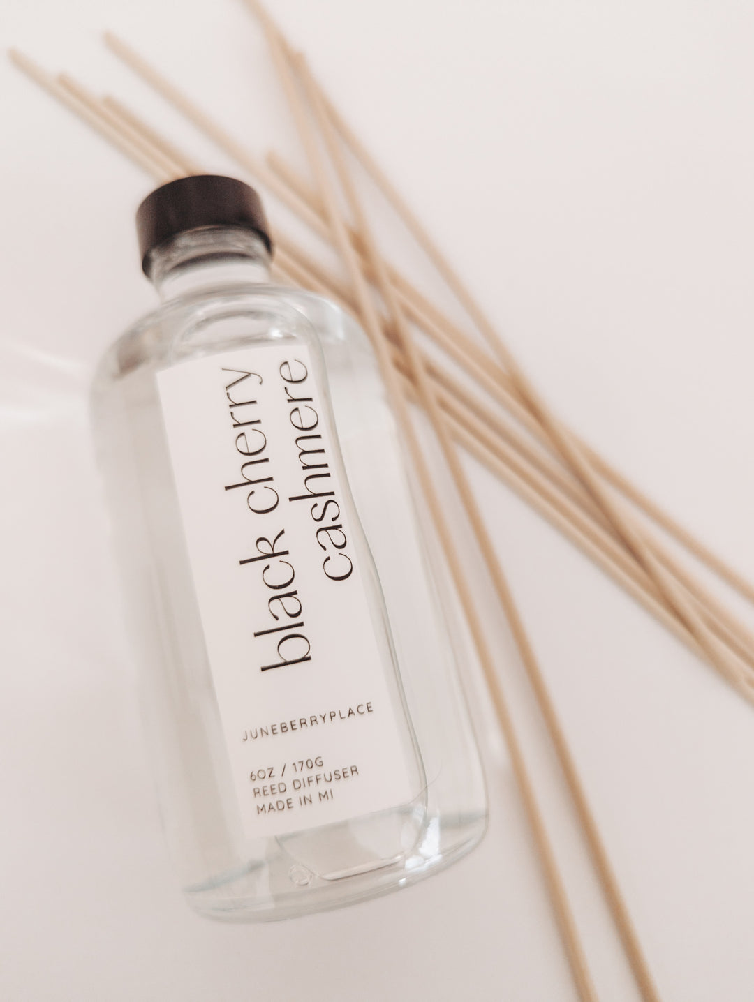 Black Cherry Cashmere Reed Diffuser in clear glass bottle with reeds by juneberryplace home fragrances