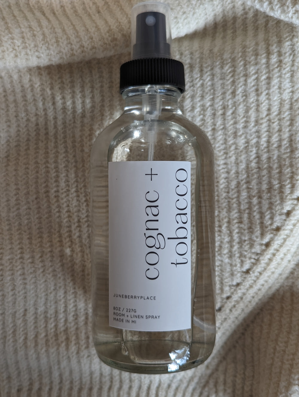 Cognac and Tobacco Room and Linen Spray in clear glass spray bottle by juneberryplace home fragrances