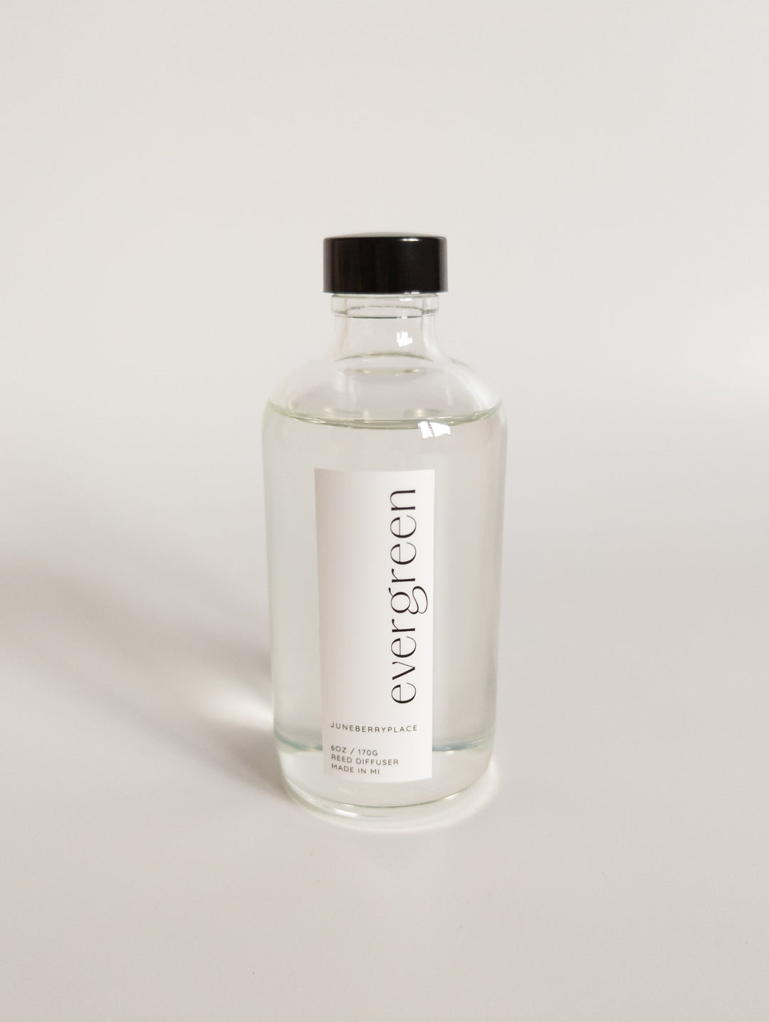 Evergreen Reed Diffuser in clear glass bottle with reeds by juneberryplace home fragrances