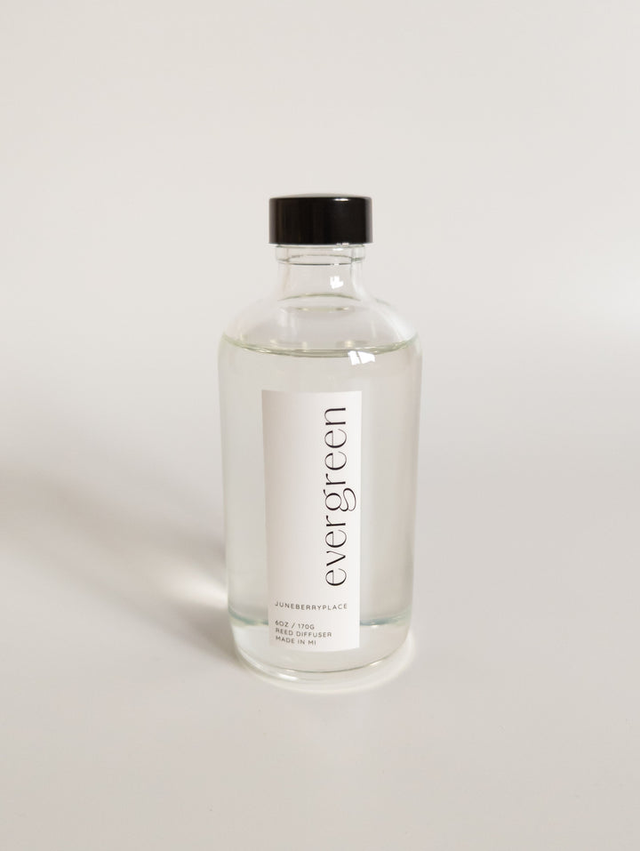 Evergreen Reed Diffuser in clear glass bottle with reeds by juneberryplace home fragrances