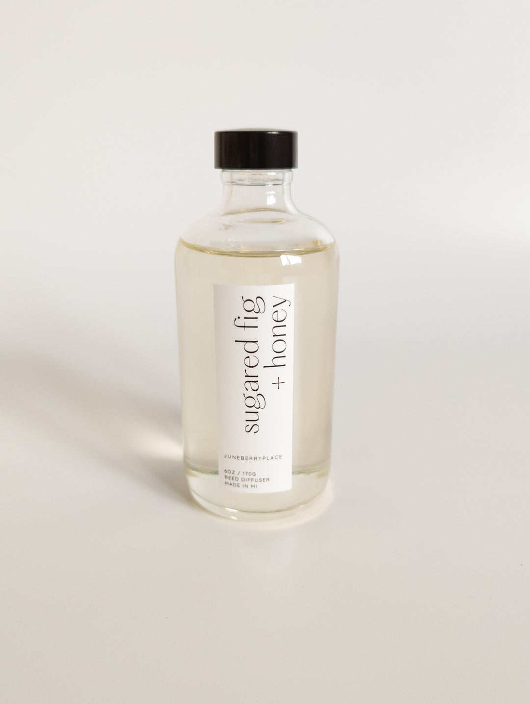 Sugared Fig and Honey reed diffuser: Winter Collection.  Modern clear glass, non-toxic formula. For home fragrance fans who love a clean aesthetic