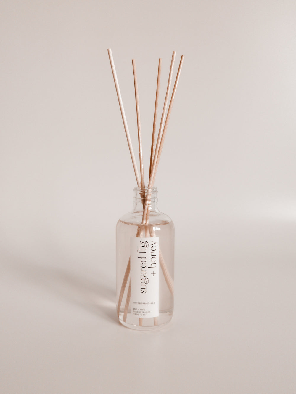 Sugared Fig and Honey reed diffuser: Winter Collection.  Modern clear glass, non-toxic formula. For home fragrance fans who love a clean aesthetic