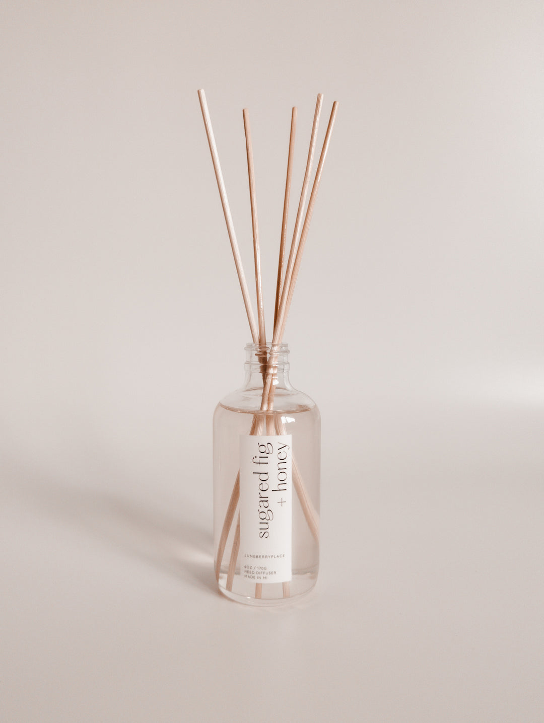 Sugared Fig and Honey reed diffuser: Winter Collection.  Modern clear glass, non-toxic formula. For home fragrance fans who love a clean aesthetic