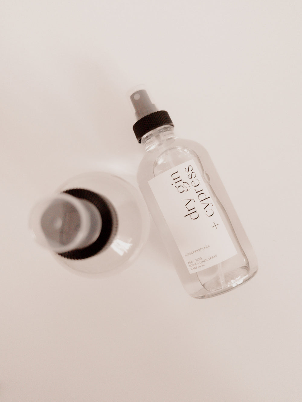 Dry Gin and Cypress Room and Linen Spray in clear glass spray bottle by juneberryplace home fragrances
