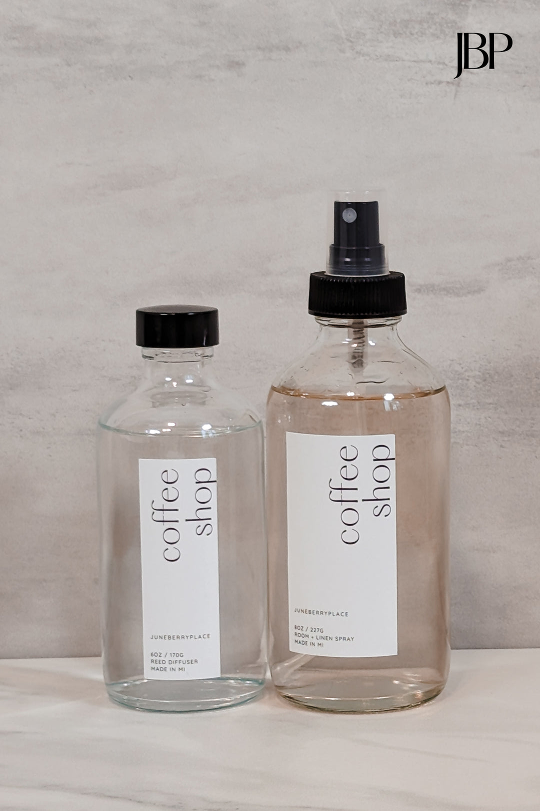 Coffee Shop Room and Linen Spray in clear glass spray bottle next to Coffee Shop Reed Diffuser without reeds by juneberryplace home fragrances