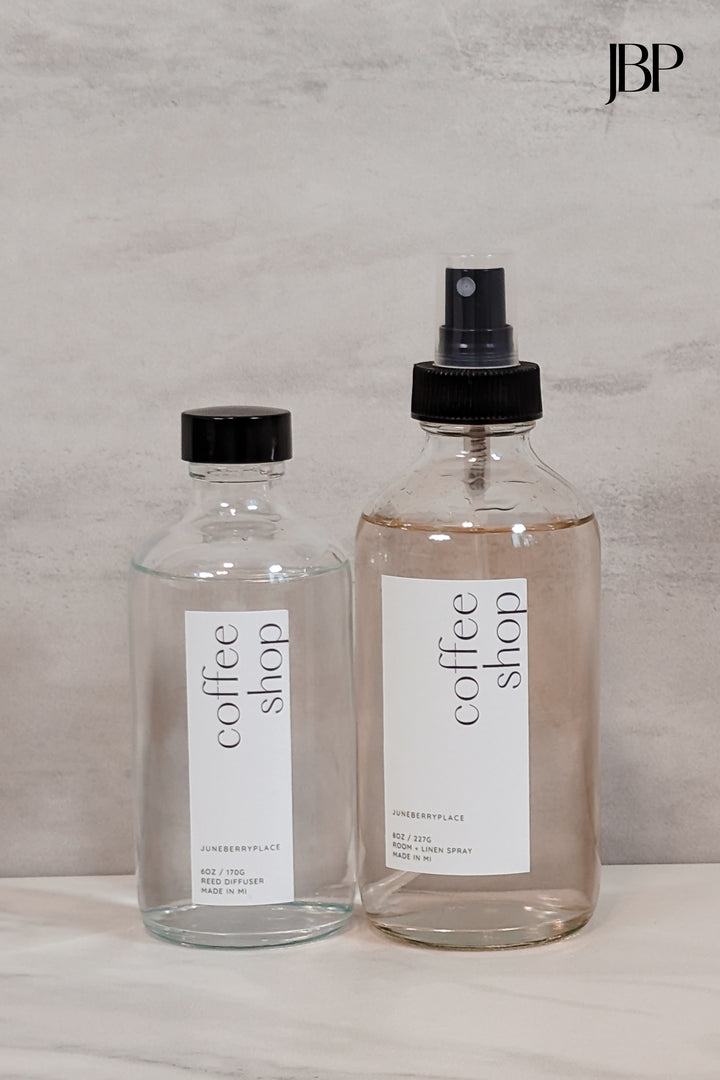 Coffee Shop Room and Linen Spray in clear glass spray bottle next to Coffee Shop Reed Diffuser without reeds by juneberryplace home fragrances