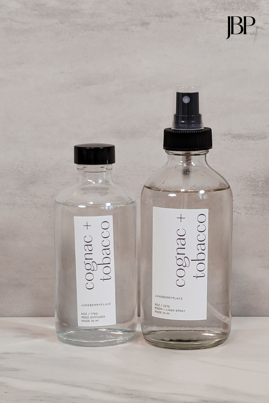 Cognac and Tobacco Room and Linen Spray and Reed Diffusers in clear glass bottles by juneberryplace home fragrances