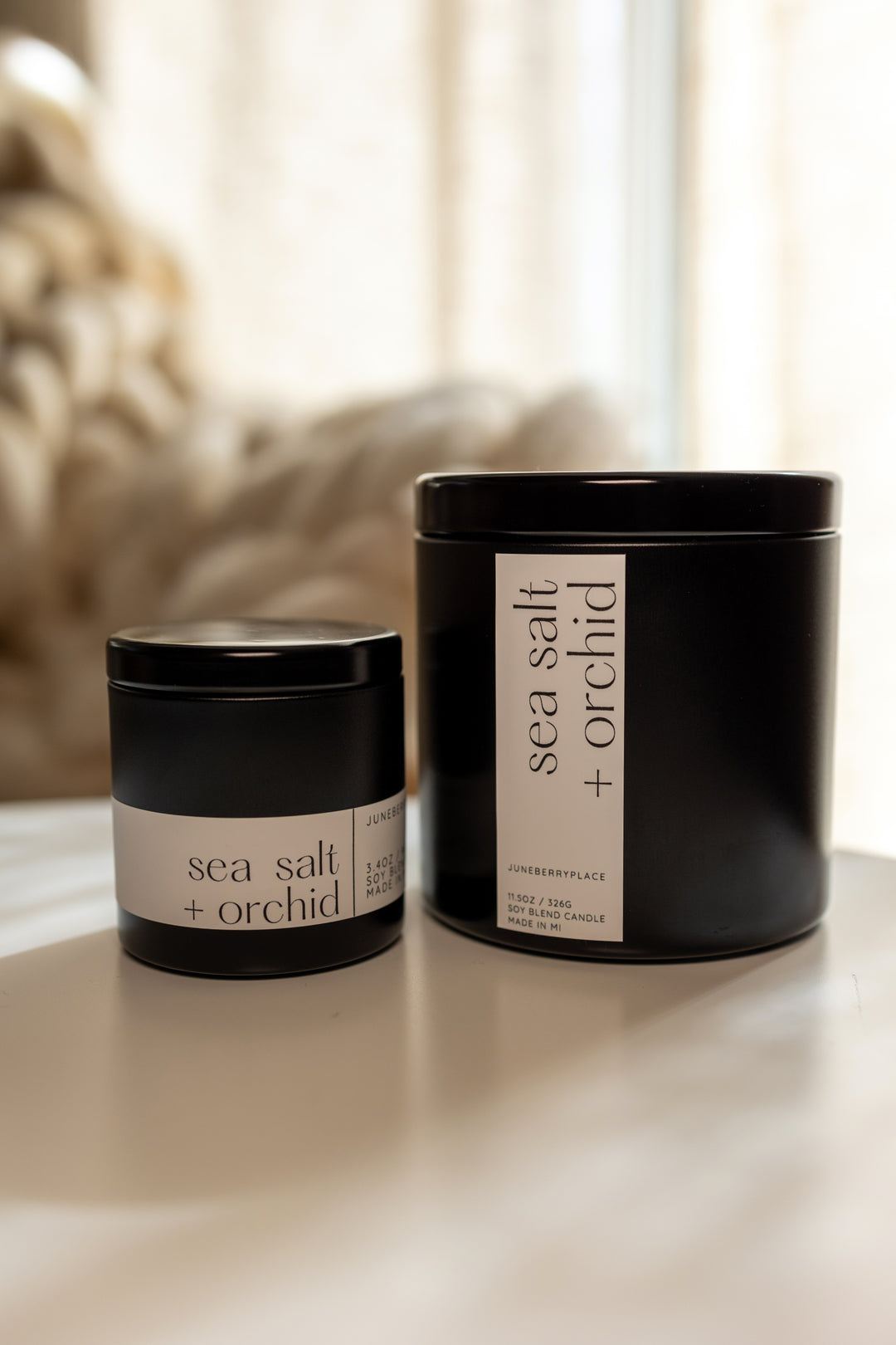 Sea Salt and Orchid Soy Candle in matte black vessel by juneberryplace home fragrances