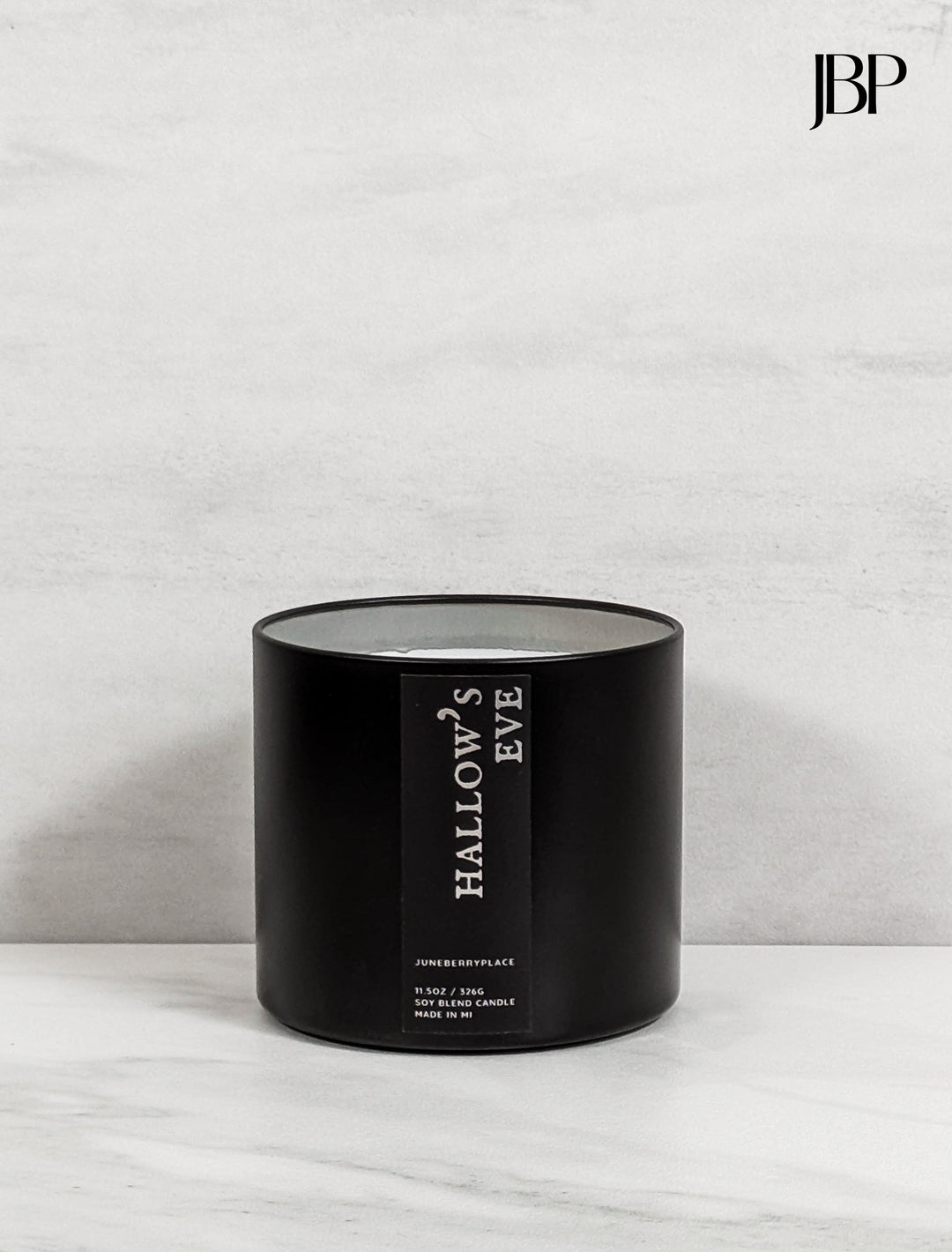 Hallow's Eve Wood Wick Soy Candle in matte black vessel by juneberryplace home fragrances