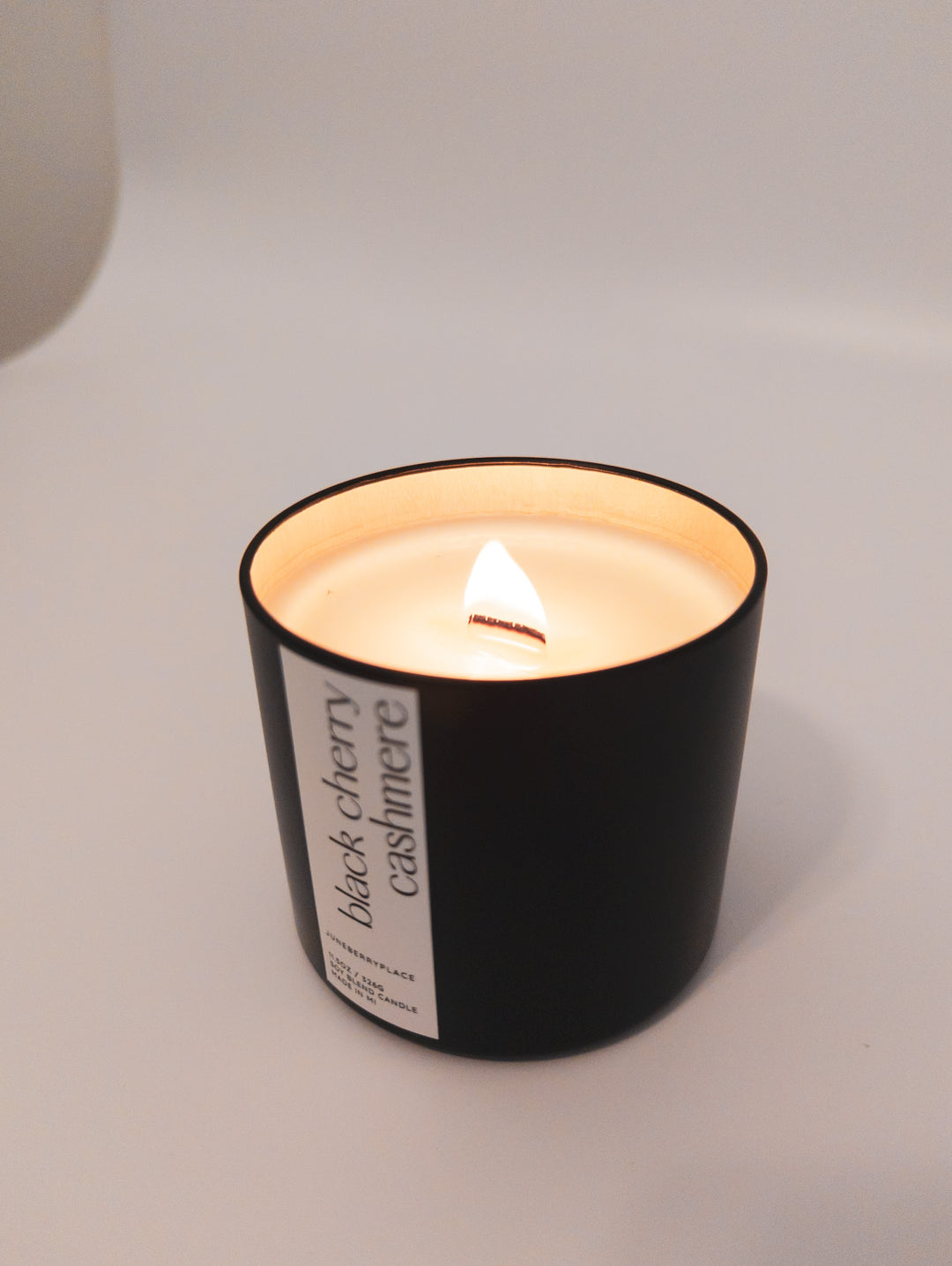 Black Cherry Cashmere Wood Wick Candle in matte black vessel by juneberryplace home fragrances