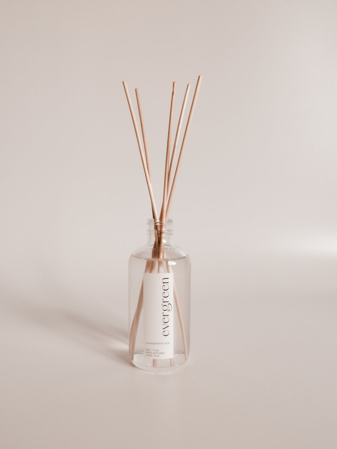 Evergreen Reed Diffuser in clear glass bottle with reeds by juneberryplace home fragrances