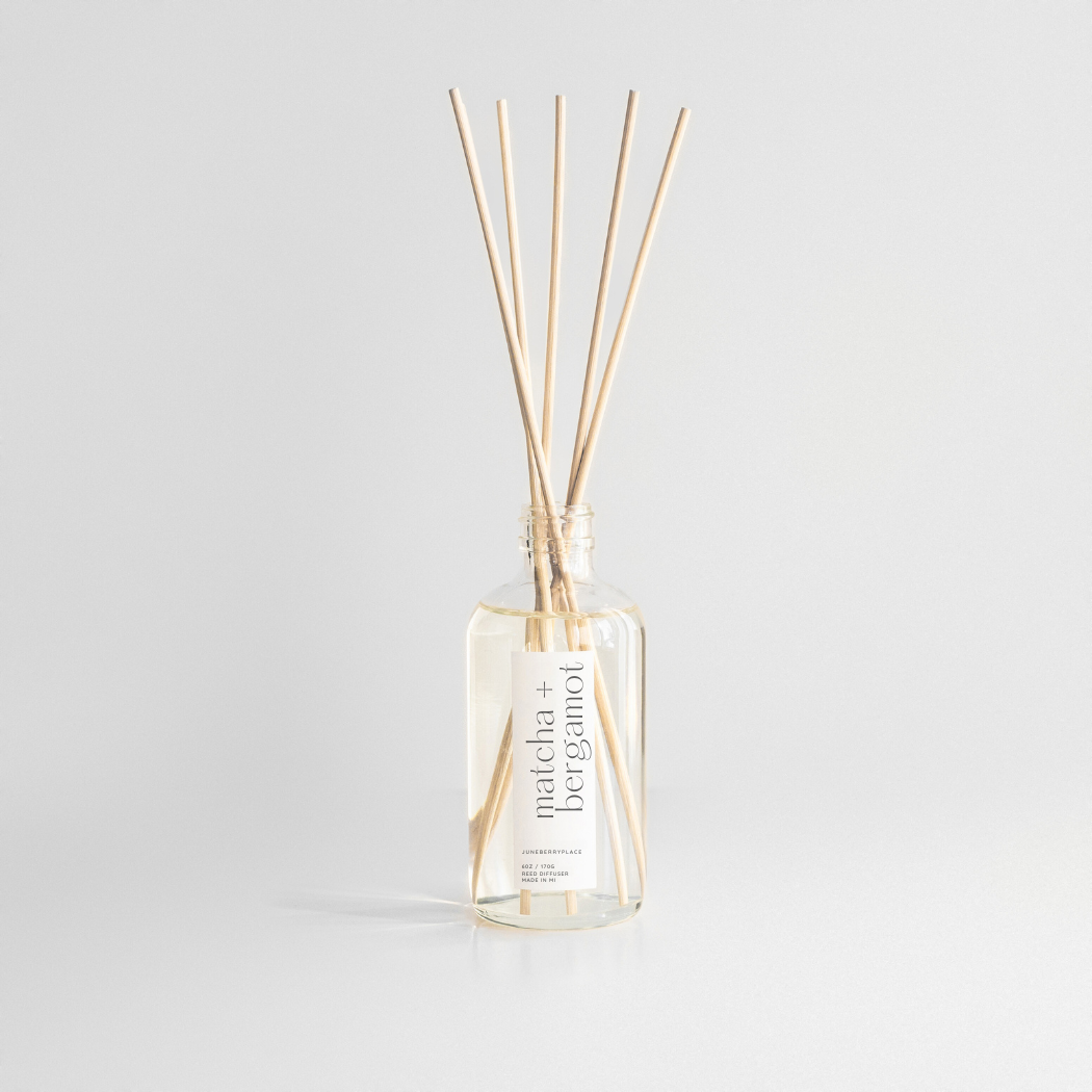 Matcha and Bergamot Reed Diffuser in clear glass bottle with reeds by juneberryplace home fragrances