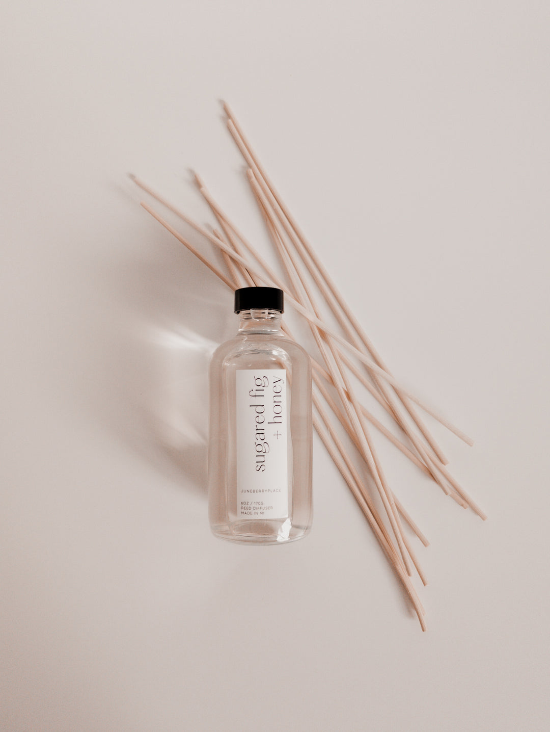 Sugared Fig and Honey reed diffuser: Winter Collection.  Modern clear glass, non-toxic formula. For home fragrance fans who love a clean aesthetic