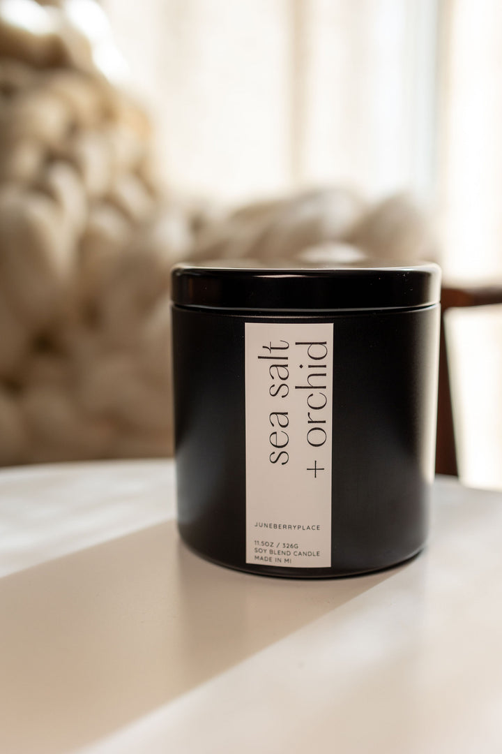 Sea Salt and Orchid Soy Candle in matte black vessel by juneberryplace home fragrances